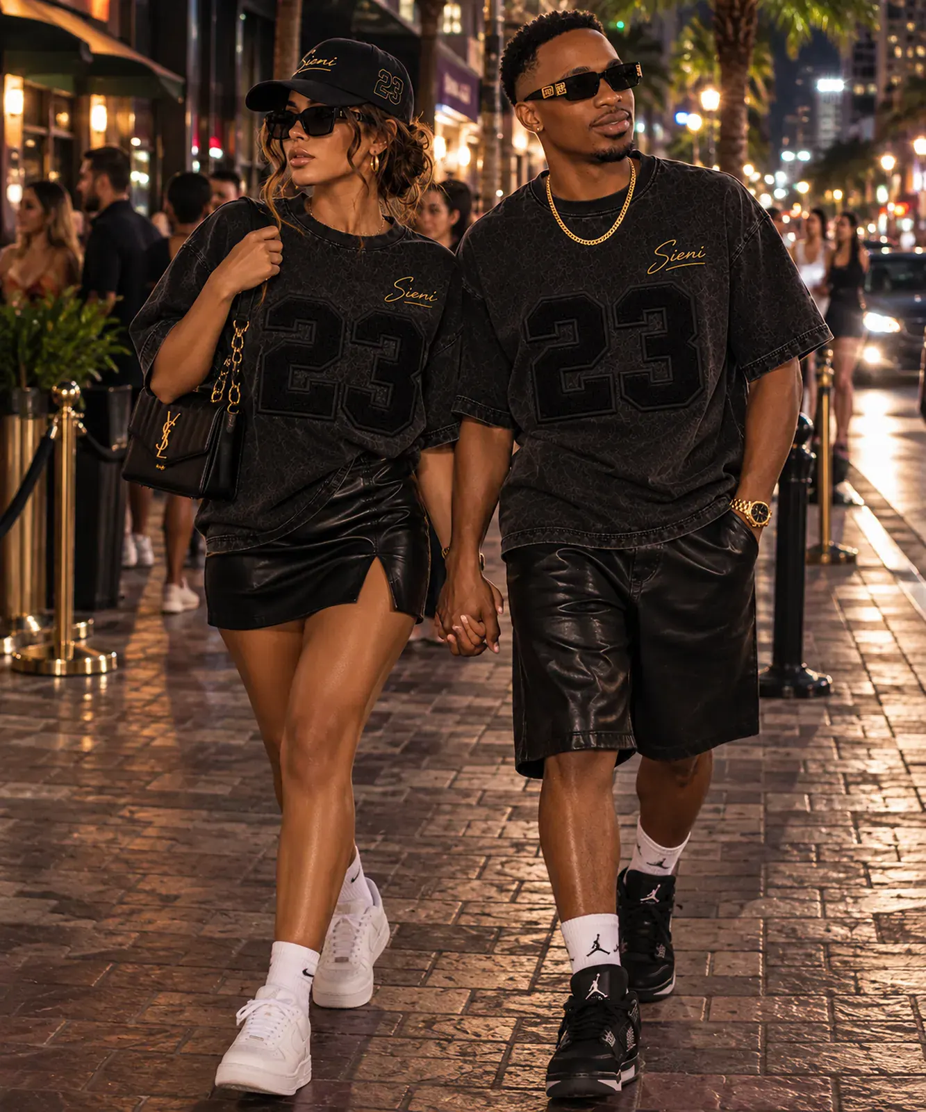 Sieni models in Varsity tees on a New York street at night